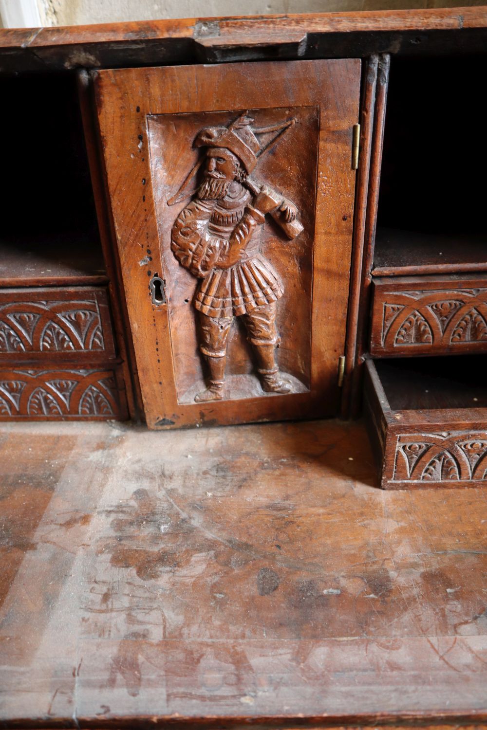 A small 18th century walnut bureau, later carved, width 76cm depth 47cm height 103cm